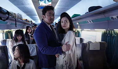 Seeing-kyeong and Sang-hwa, a working class pregnant couple in train To Busan, representing working class values and social responsibility